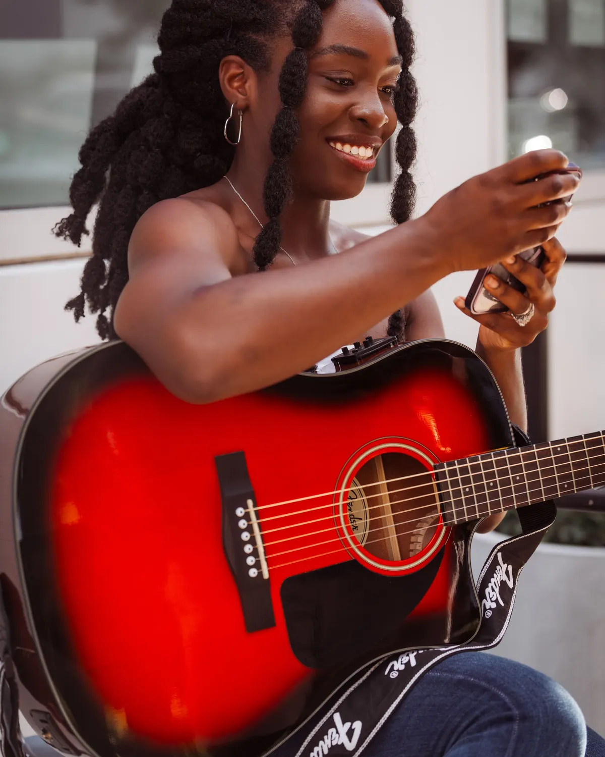 A musician with an acoustic guitar